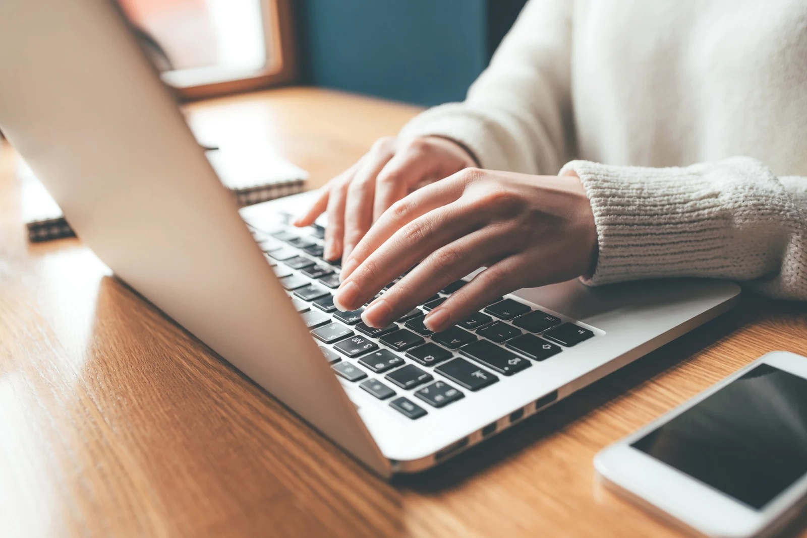Person typing on laptop
